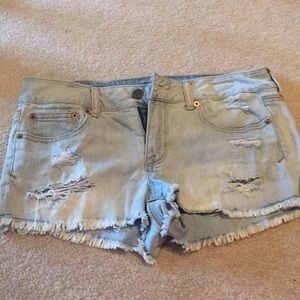 AE Mid rise distressed light jean shorts